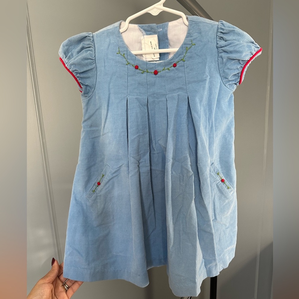 Zuccini kids blue dress with red rosettes.
